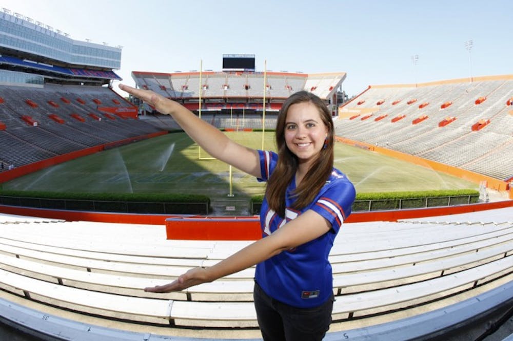 <p>Elizabeth Graham, winner of ESPNU’s Ultimate College Sports Fan contest, poses in Ben Hill Griffin Stadium on Wednesday.</p>