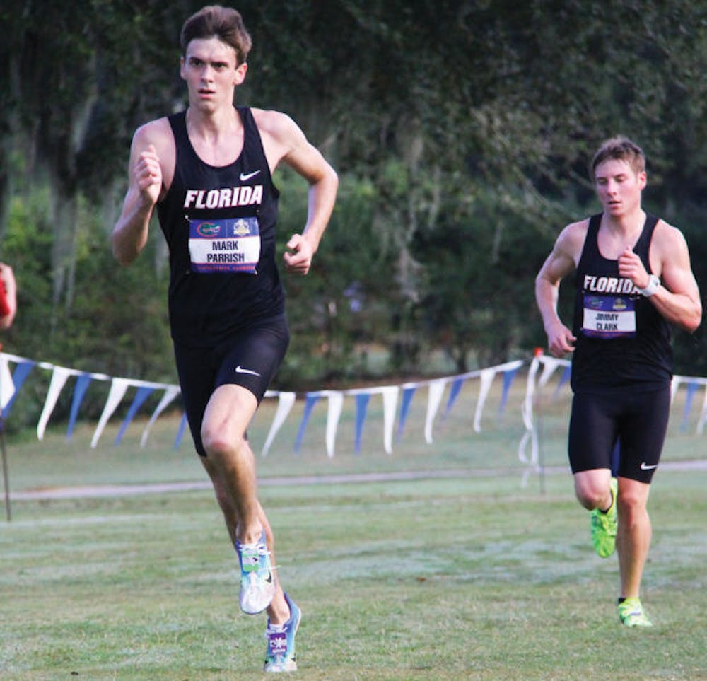 <p>Mark Parrish (left) and Jimmy Clark run during the SEC Championships on Nov. 1 in Gainesville. The NCAA Championships begin today.</p>
