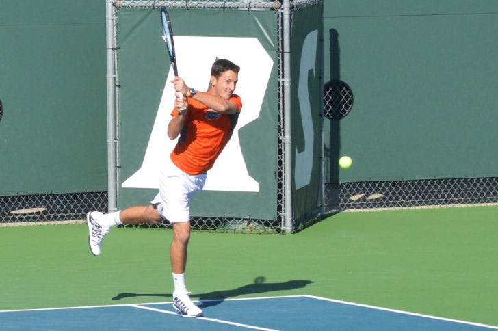 Gordon Watson returns a ball during Florida’s 5-2 win against North Florida on Jan. 22 at the Ring Tennis Complex.
