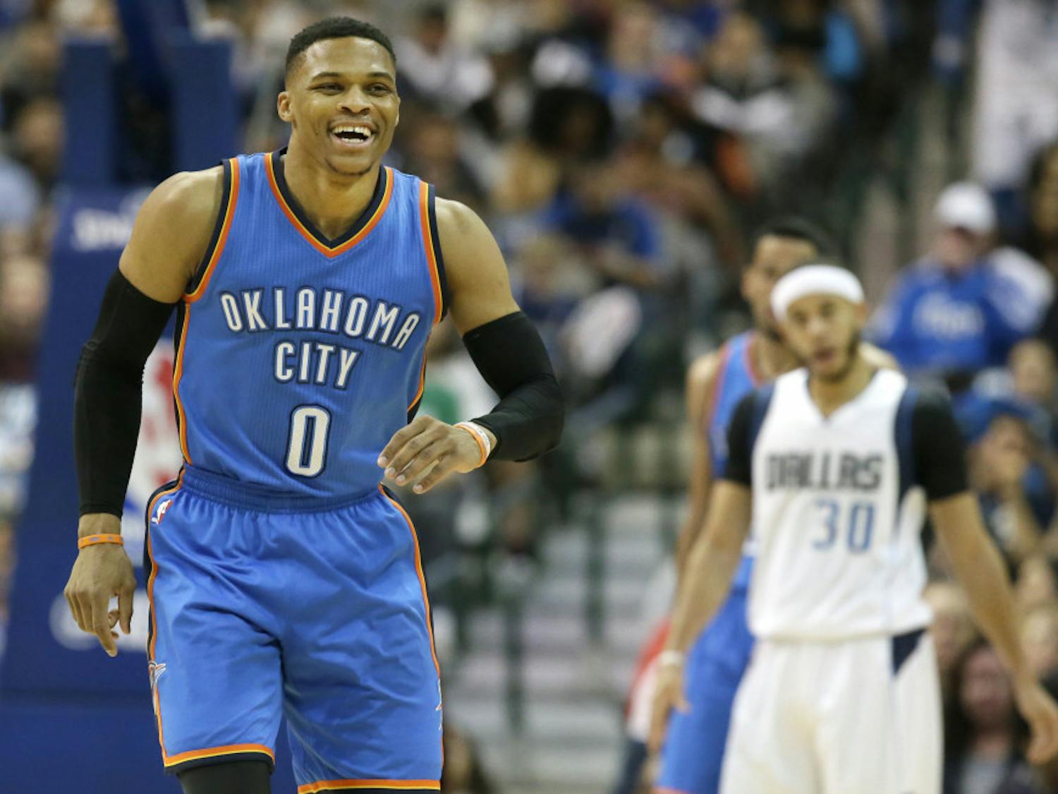 FILE - In this March 5, 2017, file photo, Oklahoma City Thunder guard Russell Westbrook (0) smiles on the court during the second half of an NBA basketball game against the Dallas Mavericks, in Dallas. Westbrook was once considered selfish and out of control. Now, he's harnessed his fury and competitive fire to become the ultimate teammate. (AP Photo/LM Otero, File)