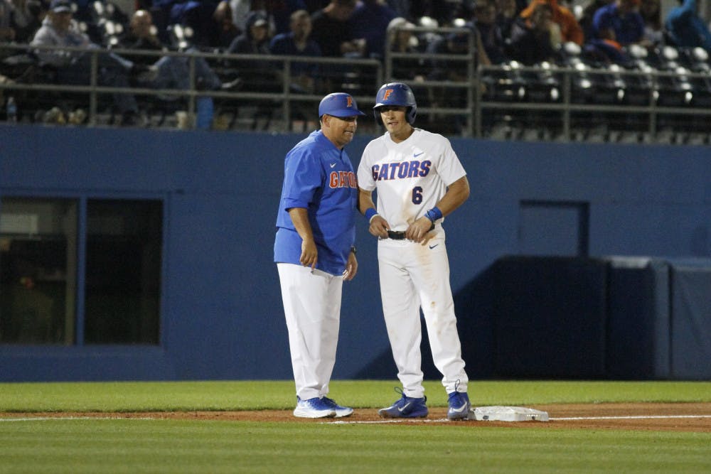 Jonathan India (right) stands on third base during Florida's 5-4 win over the William and Mary Tribe on Friday, Feb. 17, 2017, at McKethan Stadium. 
