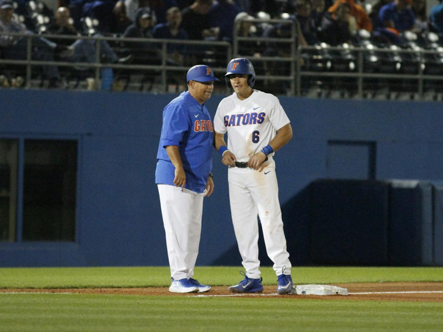 Jonathan India (right) stands on third base during Florida's 5-4 win over the William and Mary Tribe on Friday, Feb. 17, 2017, at McKethan Stadium.