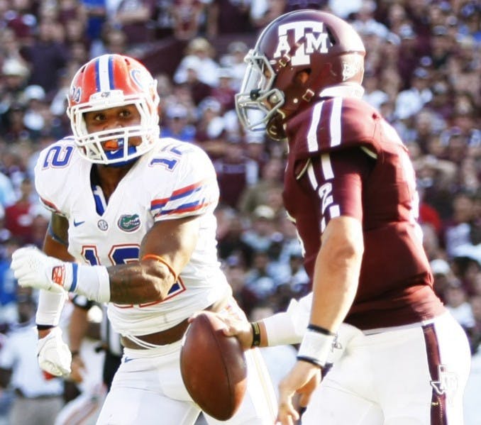 Freshman linebacker Antonio Morrison(12) chases down Texas A&amp;M quarterback Johnny Manziel (2) at Kyle Field during Florida's 20-17 victory against Texas A&amp;M on Sept. 8.&nbsp;