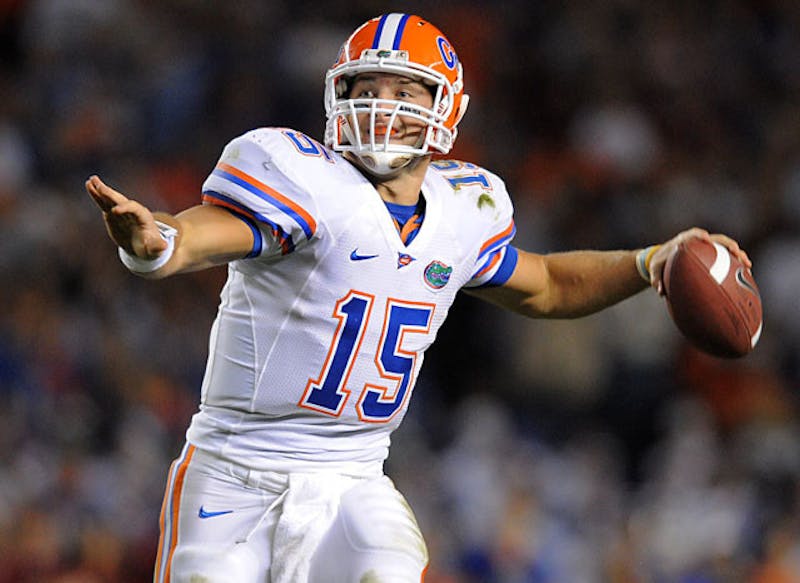 Quarterback Tim Tebow #15 of the Florida Gators rolls out against the  Florida State Seminoles at Ben H…