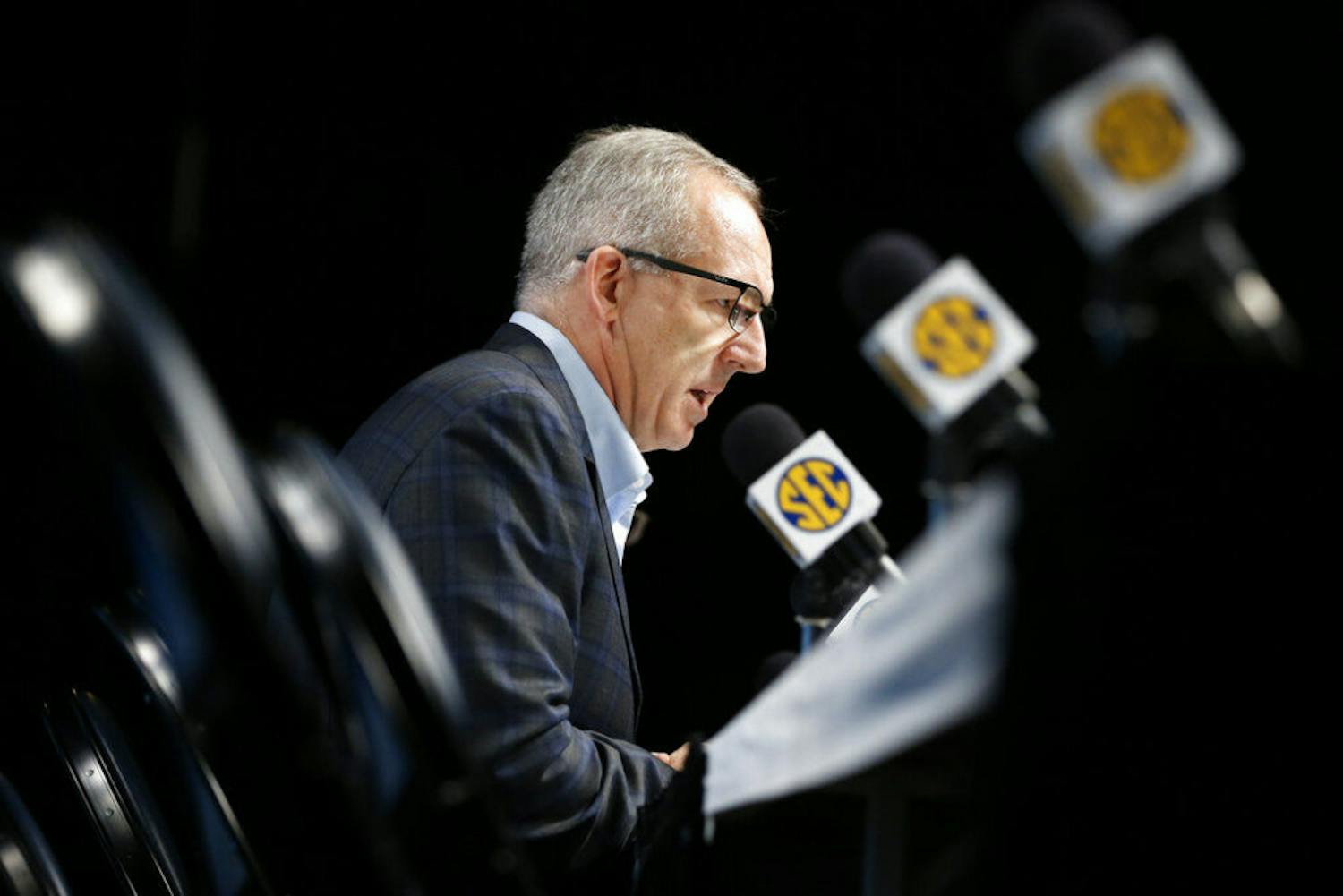 Greg Sankey, commissioner of the Southeastern Conference, talks about the decision to cancel the remaining games in the SEC NCAA college basketball tournament Thursday, March 12, 2020, in Nashville, Tenn. The conference tournament was cancelled Thursday due to coronavirus concerns. (AP Photo/Mark Humphrey)