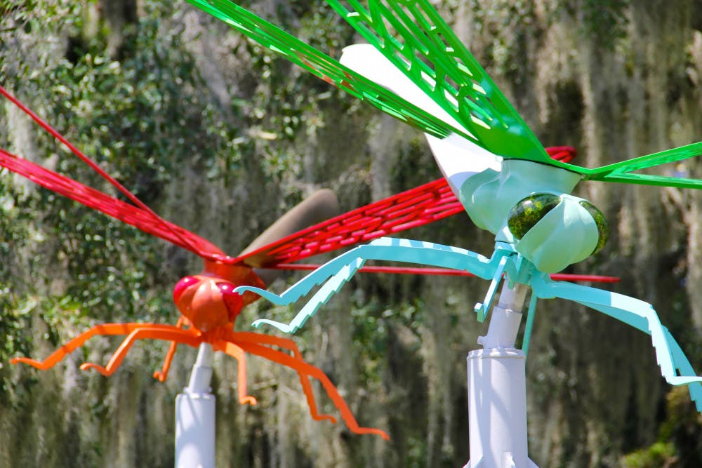 Two new dragonfly statues stand outside of the UF College of the Arts building facing Southwest 13th Street.
