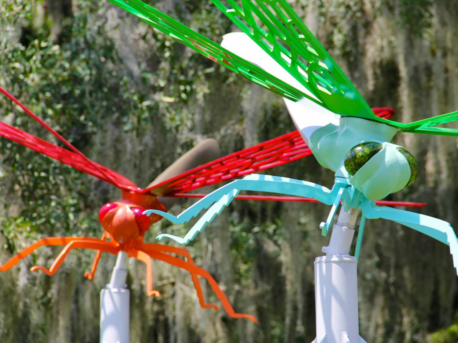 Two new dragonfly statues stand outside of the UF College of the Arts building facing Southwest 13th Street.