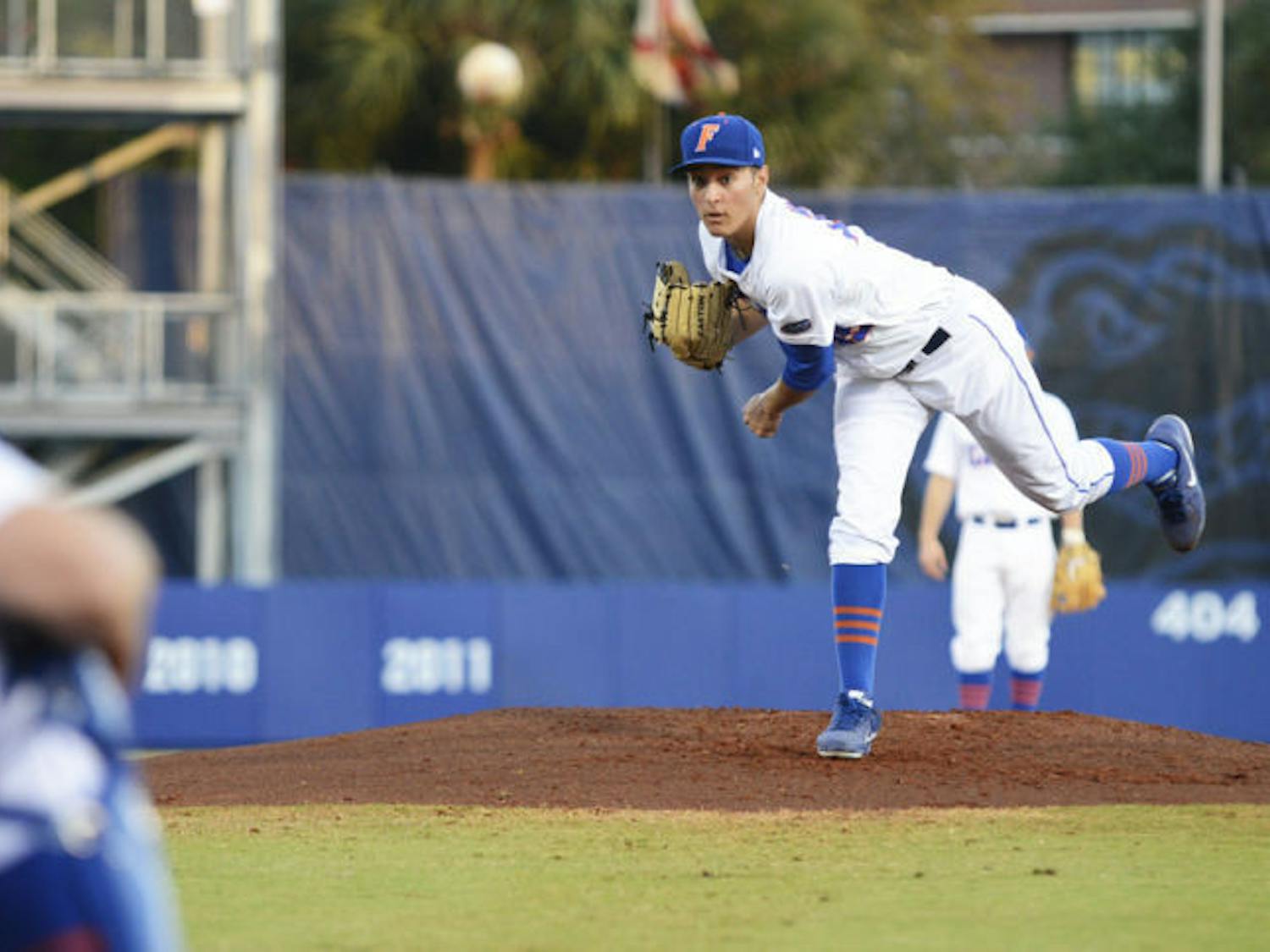 Left-handed pitcher Danny Young (15) warms up between innings during Florida’s 4-1 loss to Florida State on March 12 at McKethan Stadium. The freshman allowed two hits in four innings against the Seminoles on Tuesday night.
