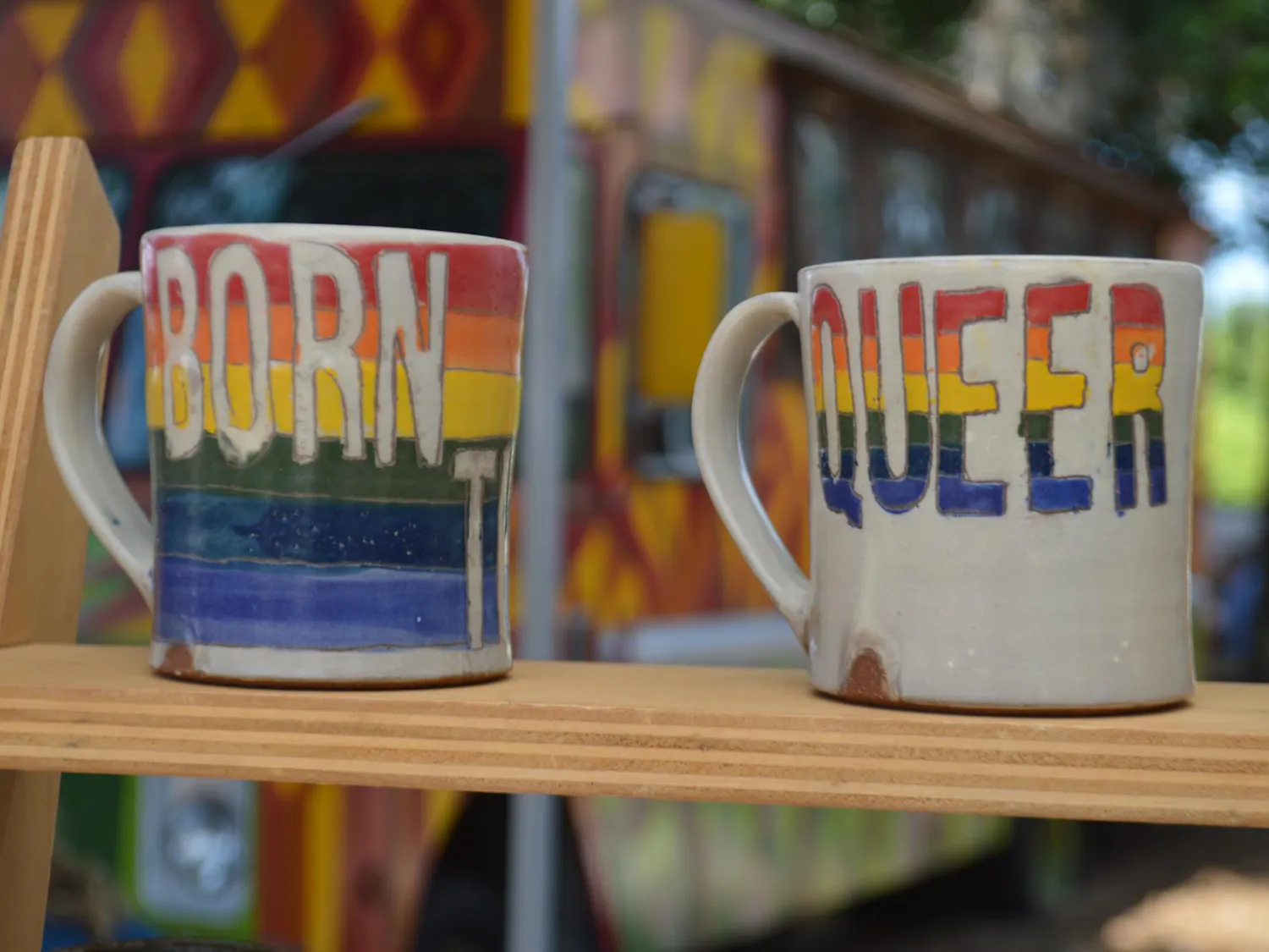 Mugs from Studio TM Ceramics wait to be purchased at the "Queer Makers Market" at 4th Ave Food Park in Gainesville, Fla., on Sunday, June 7, 2026.