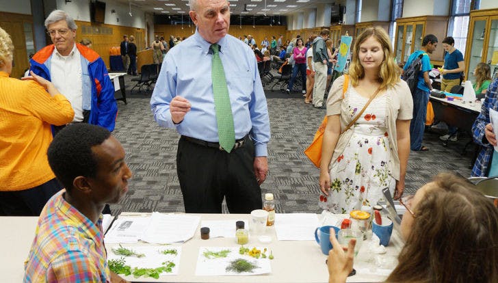 UF President Bernie Machen learns about teas from UF seniors Kamal Gray, 21, and Brielle Martinez, 21, before delivering his State of Sustainability address at Sustainable UF’s Campus Earth Day Celebration on Friday.