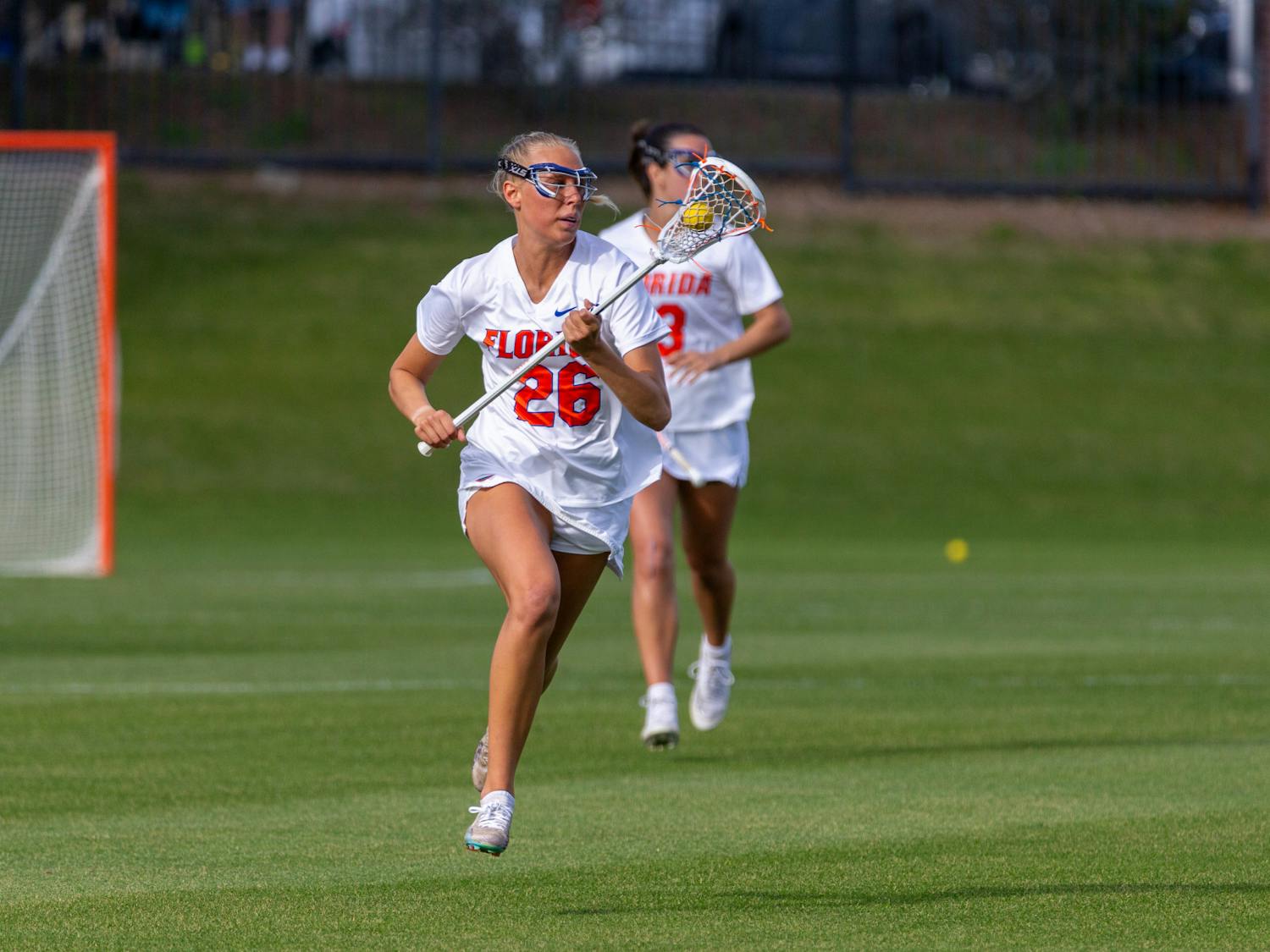 Freshman defender Ashley Dyer runs up the field during the Florida Gators’ Lacrosse game against the Jacksonville Dolphins on Wednesday, February 28. Photo by Ryan Friedenberg