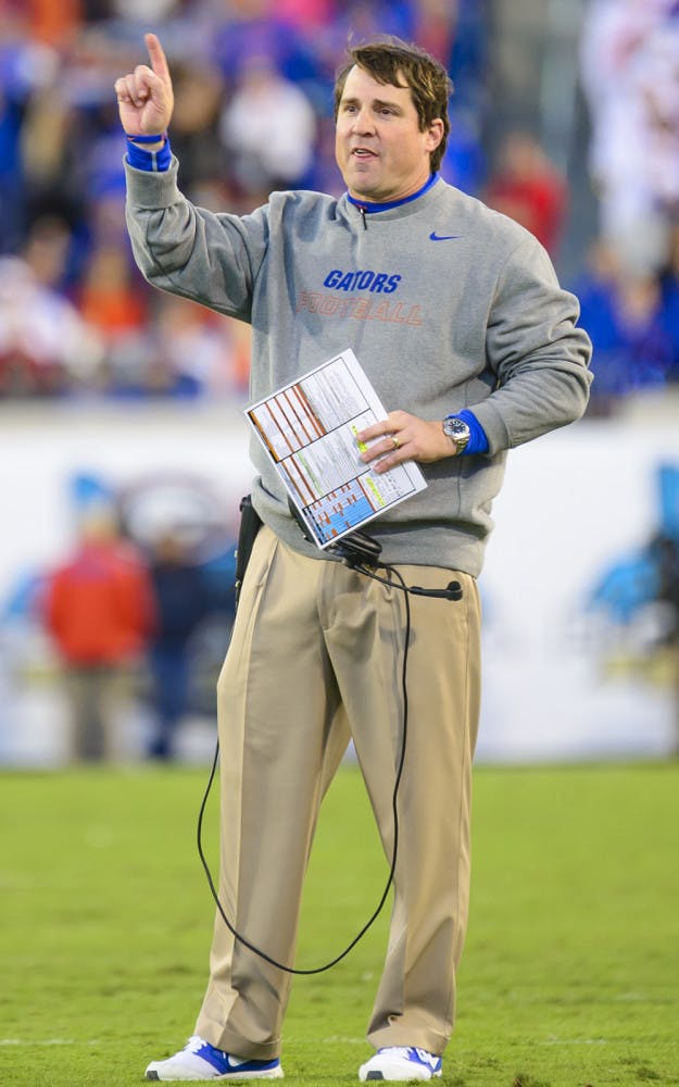 Will Muschamp signals during UF's 38-20 win against UGA on Nov. 1 at EverBank Field in Jacksonville.