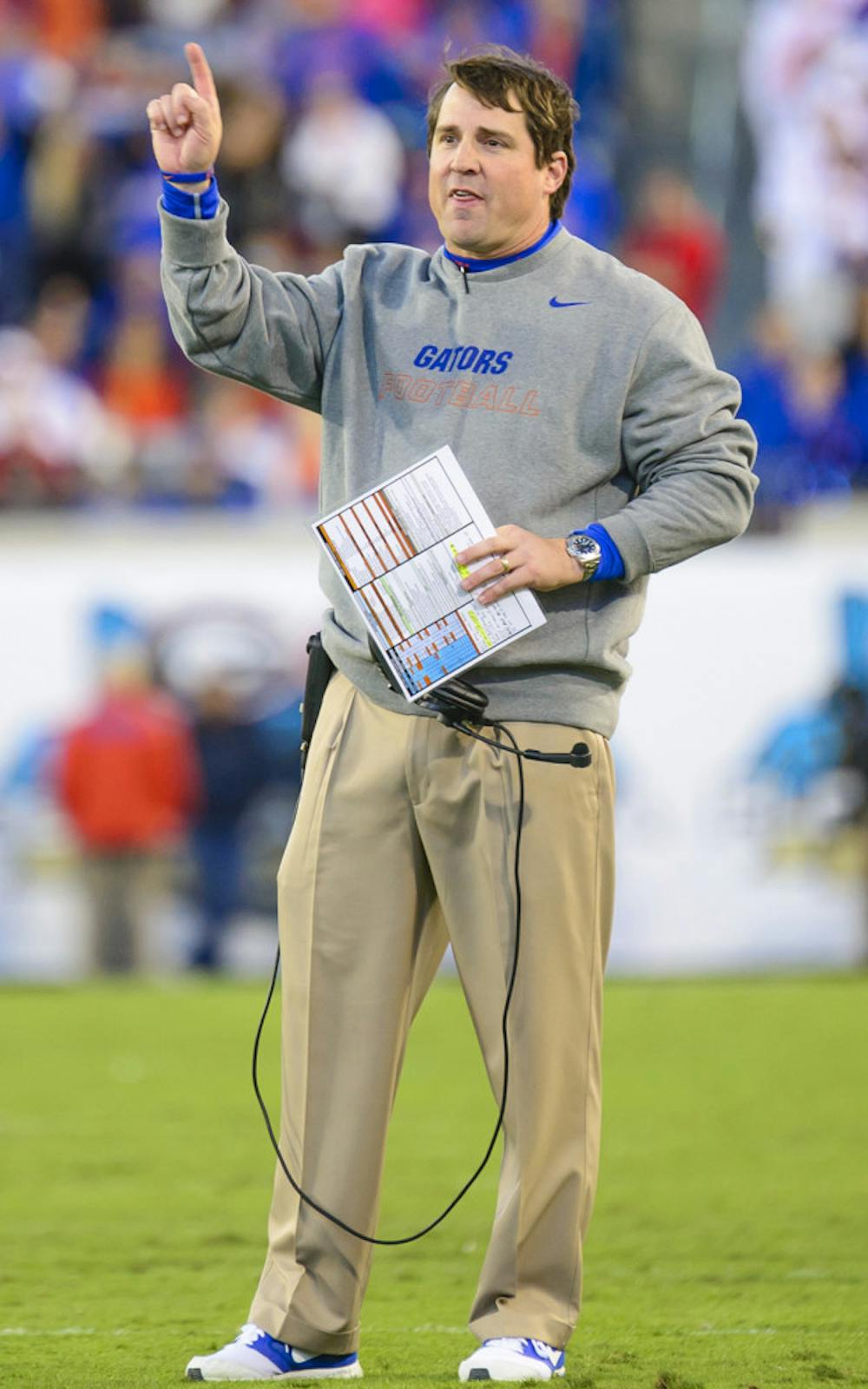 <p>Will Muschamp signals during UF's 38-20 win against UGA on Nov. 1 at EverBank Field in Jacksonville.</p>