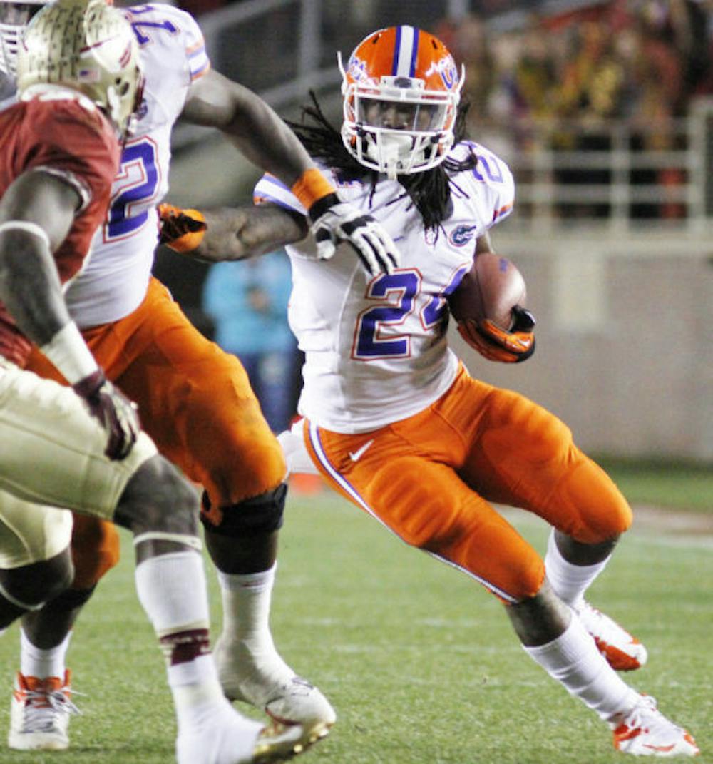 <p align="justify">Sophomore running back Matt Jones runs the ball during Florida’s 37-26 victory against Florida State on Nov. 24 at Doak Campbell Stadium.</p>