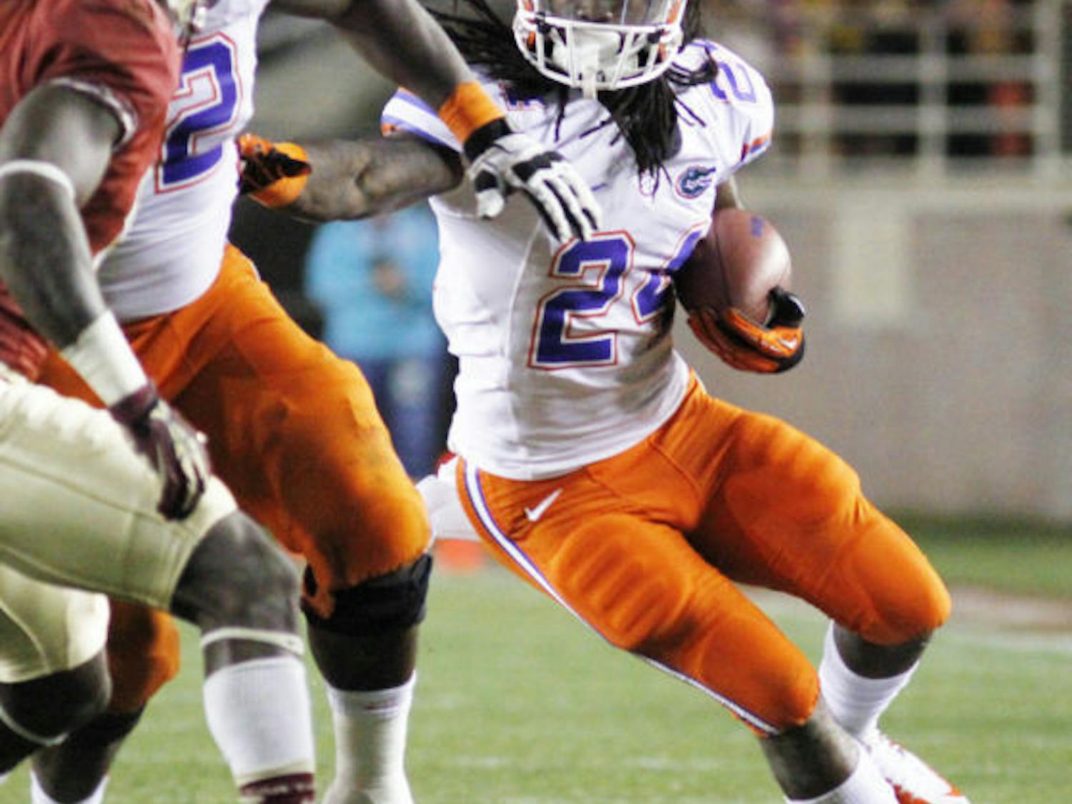 Sophomore running back Matt Jones runs the ball during Florida’s 37-26 victory against Florida State on Nov. 24 at Doak Campbell Stadium.