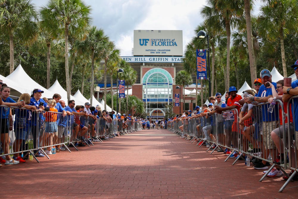 <p>Florida fans line up outside of Ben Hill Griffin Stadium for Gator Walk Saturday, Sept. 3, 2022. The game welcomed the largest season-opener crowd in UF history as 90,799 fans filled the stands. </p>