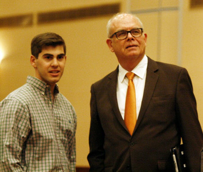 UF sustainability studies senior Stuart Block, 21, joins UF President Bernie Machen in the Reitz Union Grand Ballroom on Thursday.
