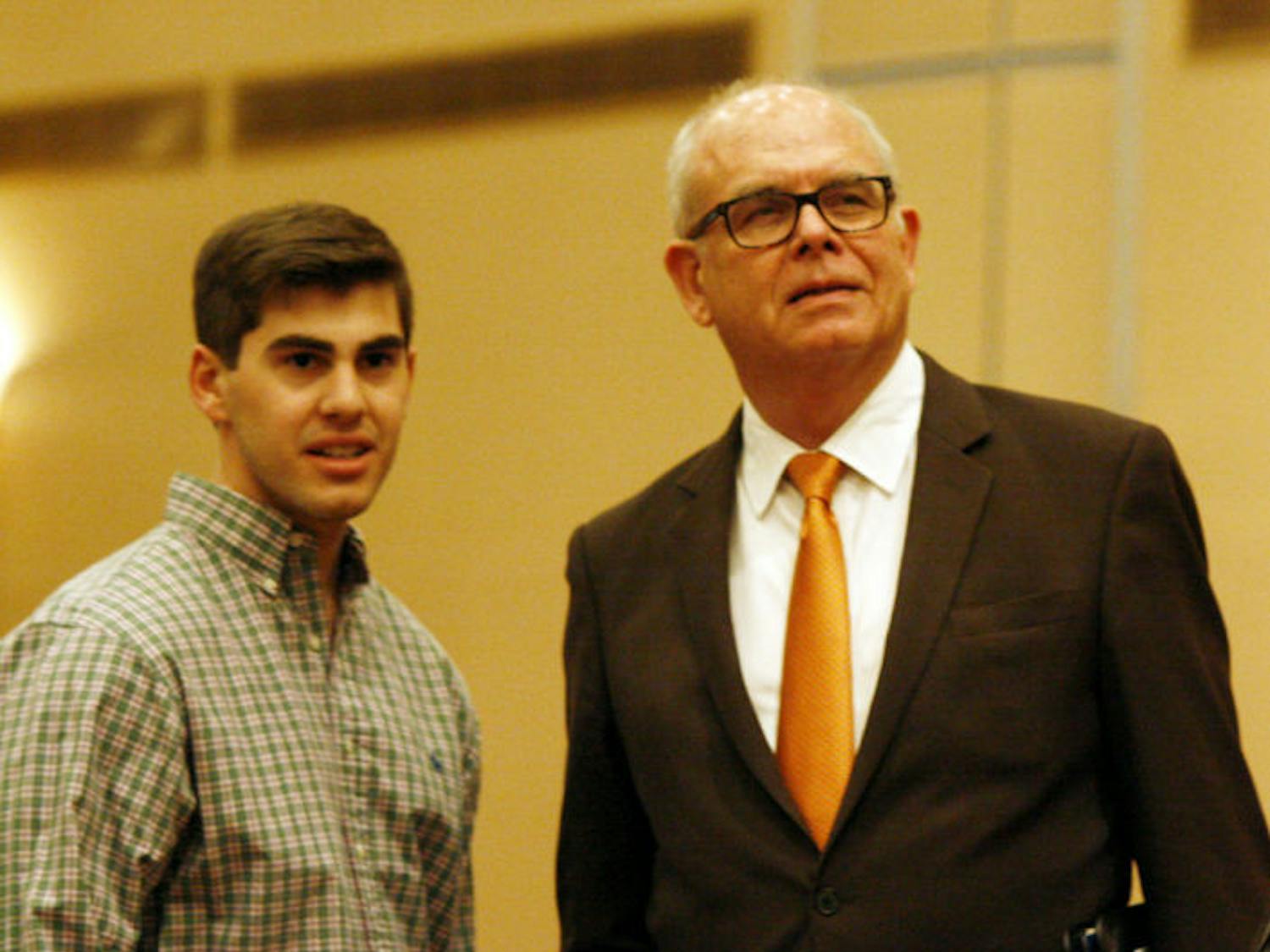 UF sustainability studies senior Stuart Block, 21, joins UF President Bernie Machen in the Reitz Union Grand Ballroom on Thursday.