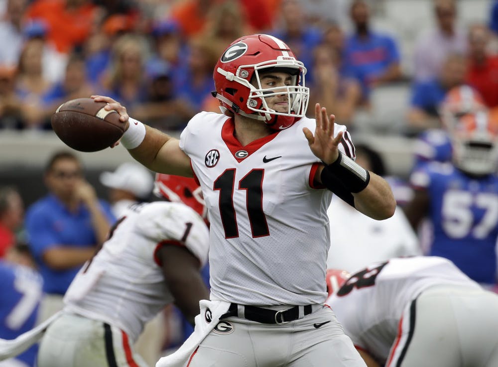 Georgia quarterback Jake Fromm (11) throws a pass against Florida in the first half of an NCAA college football game, Saturday, Oct. 28, 2017, in Jacksonville, Fla. (AP Photo/John Raoux)