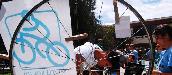 Steven Che, food science and human nutrition freshman, 19, signs up for a raffle to win a free bike light from Bicycle Benefits at the Alternative Transportation Fair in front of the Reitz Union Colonnade on Wednesday. Bicycle Benefits is a program that offers a $5 helmet decal for discounts at select local businesses.