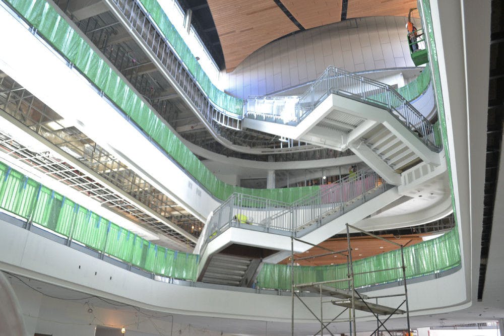 <p>The main foyer of the new expansion to the Reitz Student Union, seen on Oct. 29, 2015, was designed with UF’s mascot in mind. The railing on all three floors has alligator-shaped holes cut out and the wooden ceiling is patterned to mimic the underbelly of a gator.</p>