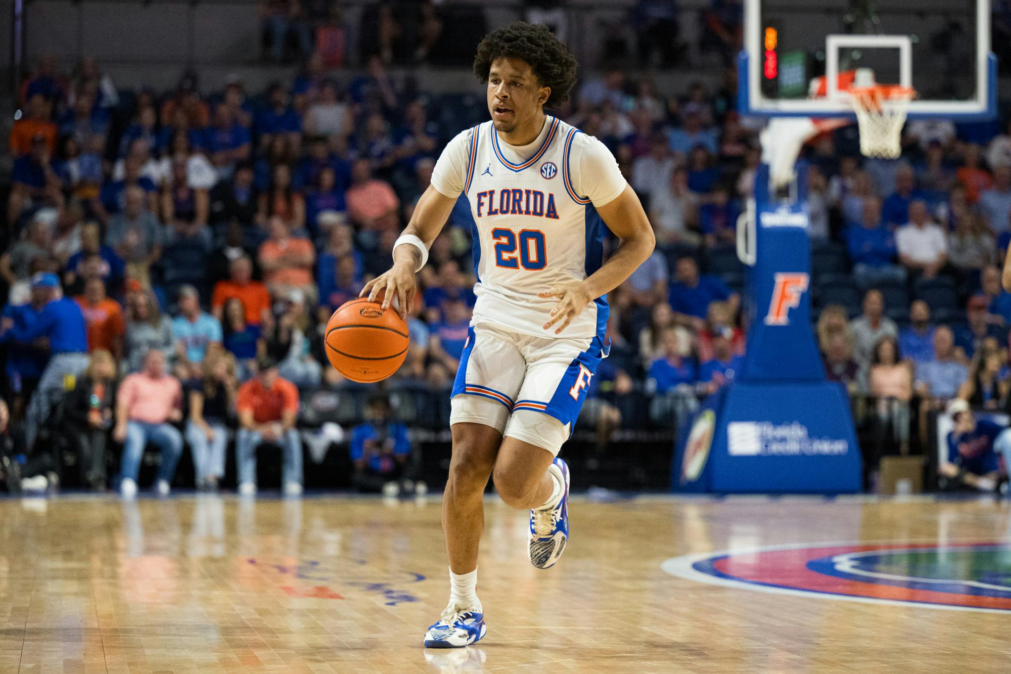 Florida Gators guard Isaiah Brown (20) dribbles the ball in a basketball game against South Carolina on Saturday, Feb. 15, 2025, in Gainesville, Fla.
