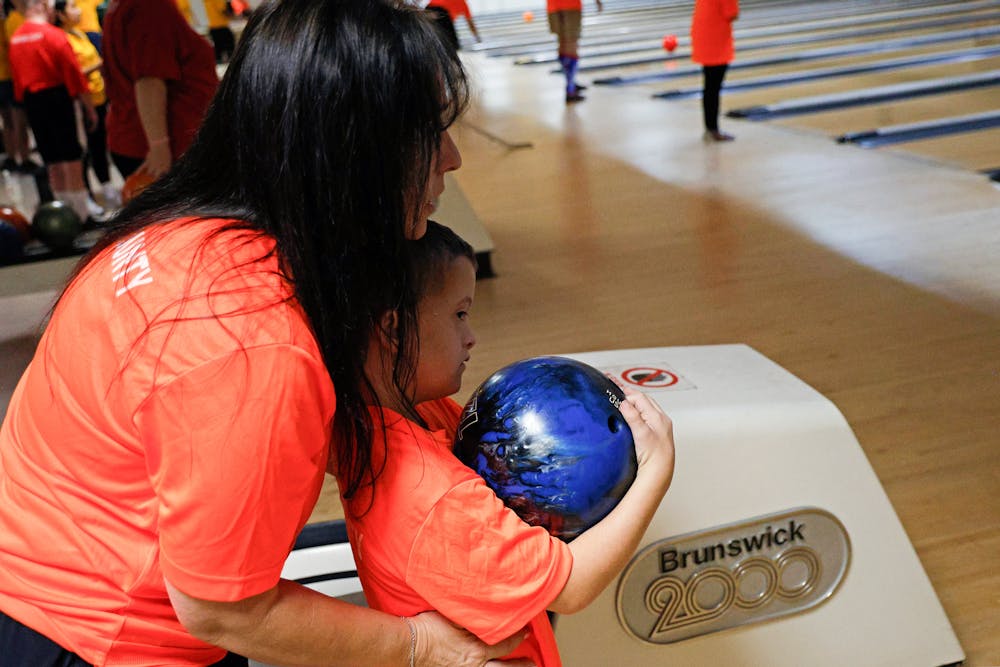 Tracy Hasson aids 10-year-old Andrew Short at Special Olympics on Saturday, July 13, 2024.