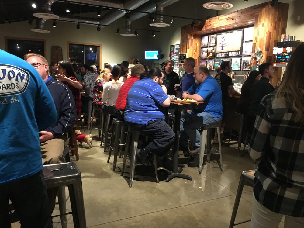 <p><span>Inside Swamp Head Brewery, people enjoyed local beer with their burrito. There were also T-shirts and raffle tickets for sale. </span></p>