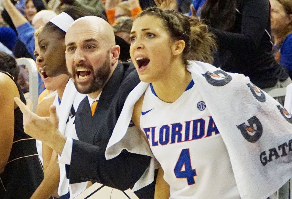 <p>UF guard Carlie Needles (right) and women's basketball assistant coach Bill Ferrera react after a play during Florida's loss to Georgia on Jan. 14, 2016, in the O'Connell Center.</p>