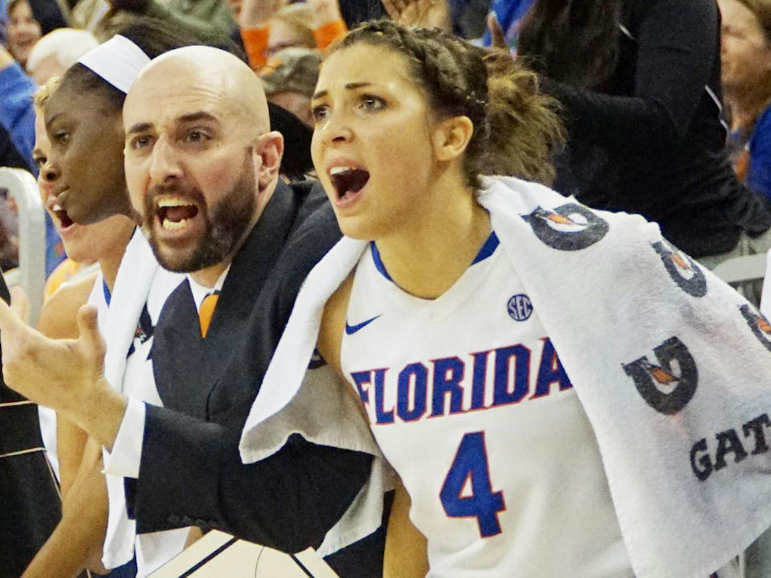 UF guard Carlie Needles (right) and women's basketball assistant coach Bill Ferrera react after a play during Florida's loss to Georgia on Jan. 14, 2016, in the O'Connell Center.