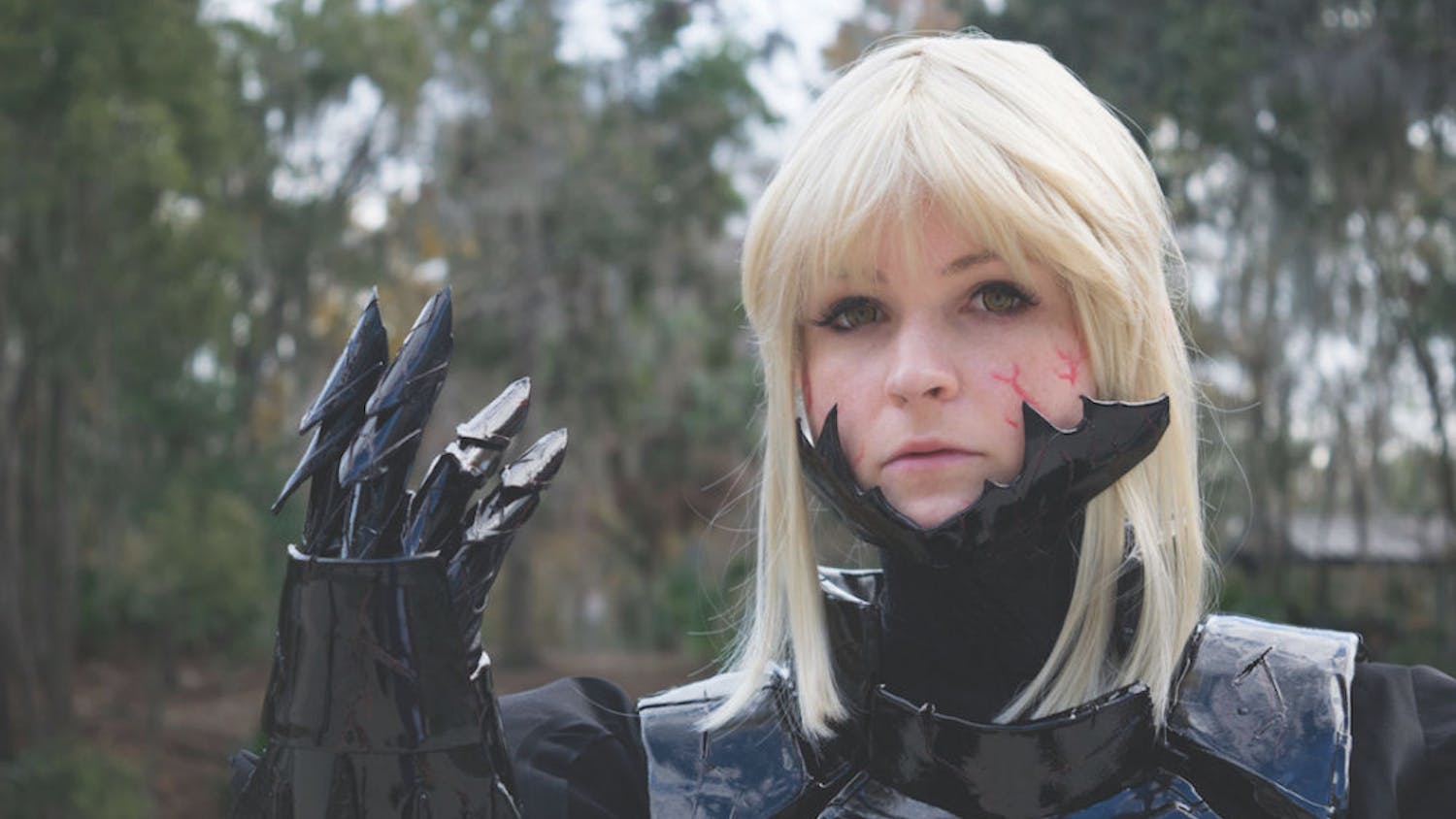 Lacey, who asked that her last name not be used, poses for a portrait on Sunday. Lacey dressed as Saber Alter, a character from the anime “Fate/stay night.”
&nbsp;