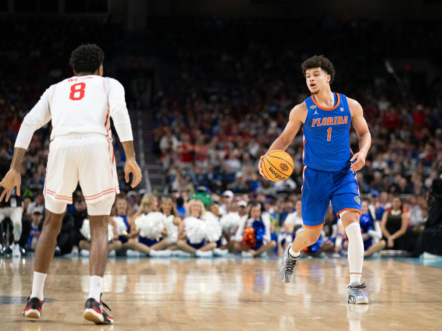 Florida Gators guard Walter Clayton Jr. (1) dribbles the ball during a basketball game against the Houston Cougars in the National Championship round of the NCAA Tournament on Monday, April 7, 2025, in San Antonio, Texas.