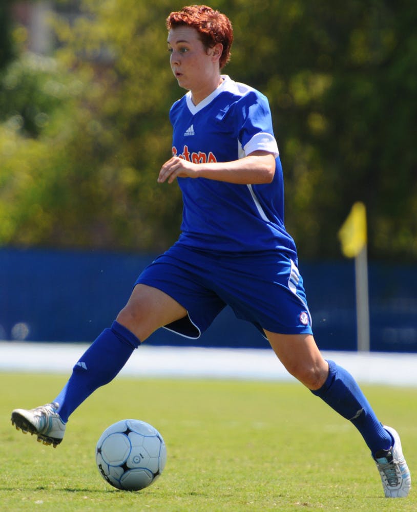 Forward Taylor Travis pushes the ball against Florida Gulf Coast on Sept. 11,  2011.