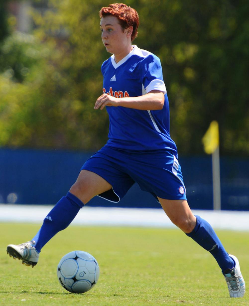 <p>Forward Taylor Travis pushes the ball against Florida Gulf Coast on Sept. 11,  2011.</p>