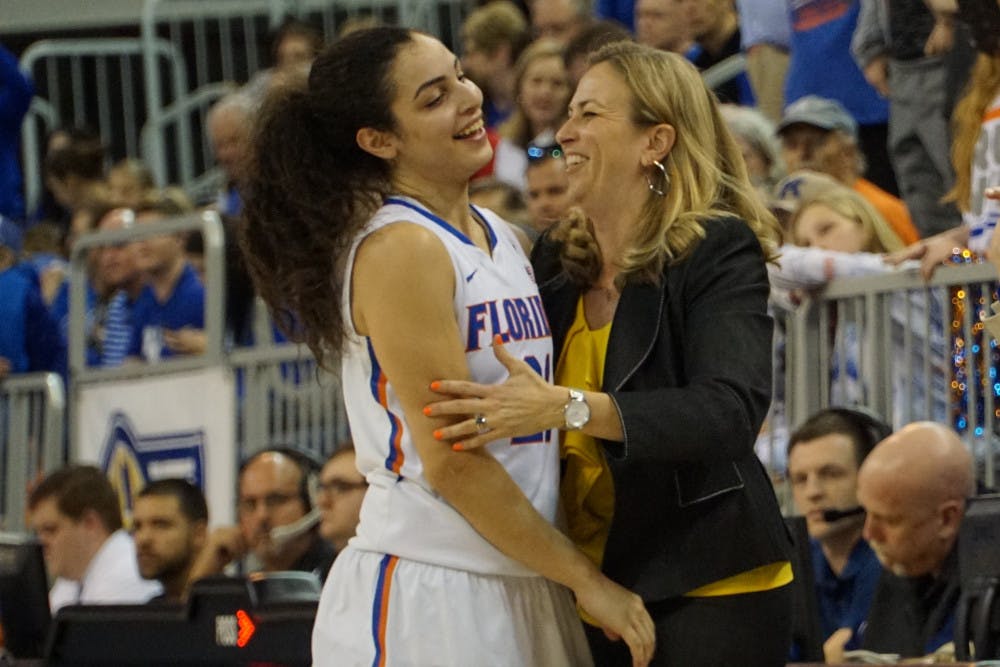 Coach Amanda Butler (right) celebrates with Eleanna Christinaki during Florida's win over Kentucky on Jan. 31, 2016, in the O'Connell Center.