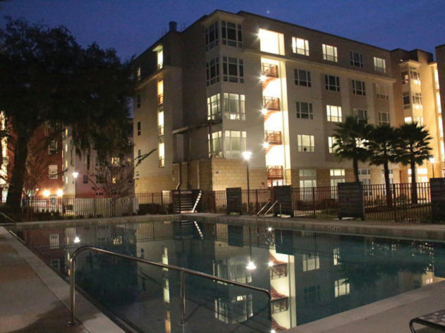 The community pool at the Continuum is empty Sunday evening. The student complex, considered UF-affiliated housing, recently faced resident complaints about verbal agreements and lease cancellations.