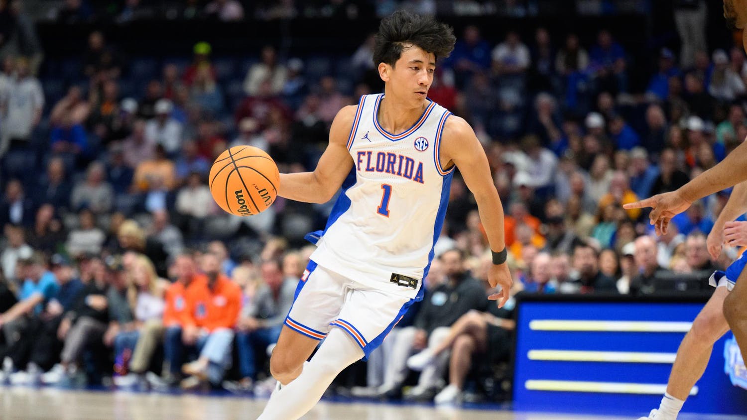 Florida guard Xaivian Lee (1) dribbles during the first half of an SEC Men's Basketball Tournament quarterfinal game against Kentucky, Friday, March 13, 2026, in Nashville, Tenn.