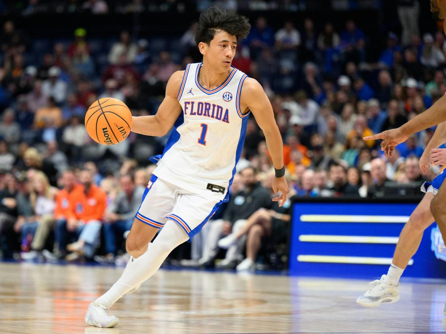 Florida guard Xaivian Lee (1) dribbles during the first half of an SEC Men's Basketball Tournament quarterfinal game against Kentucky, Friday, March 13, 2026, in Nashville, Tenn.