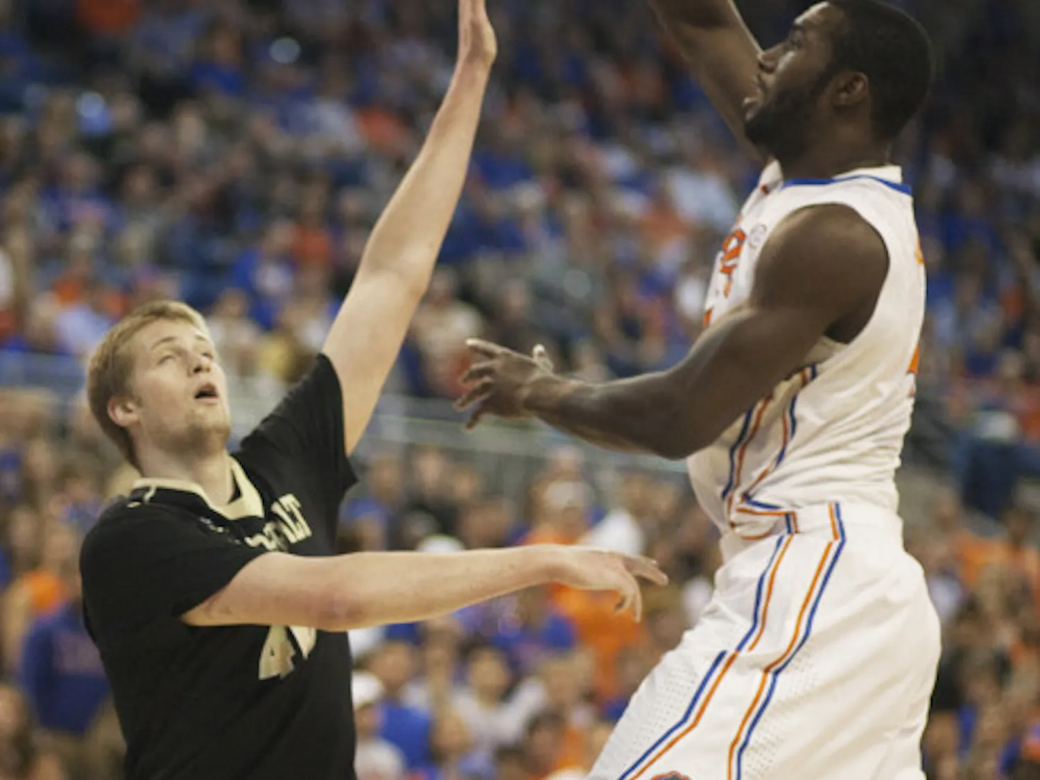 Junior center Patric Young (right) attempts a hook shot during Florida’s 66-40 win against Vanderbilt on March 6 in the O’Connell Center. .