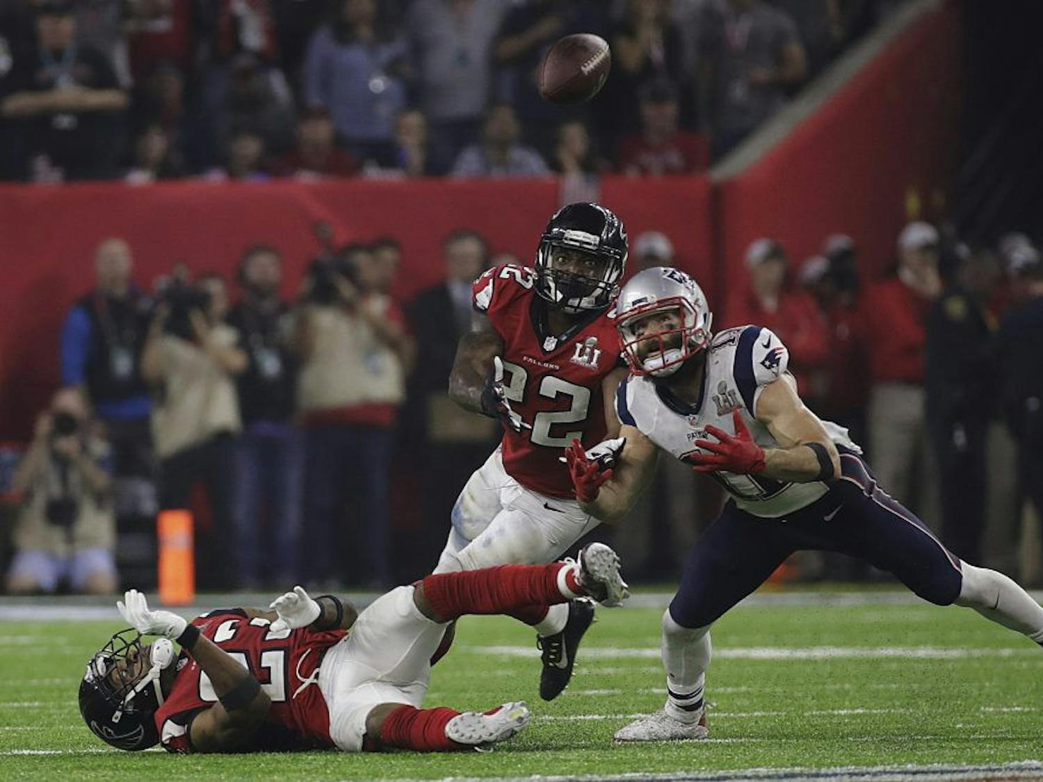 New England Patriots' Julian Edelman eyes the ball before making the catch as Atlanta Falcons' Robert Alford, left, and Keanu Neal defend, during the second half of Super Bowl 51 in Houston. (Patrick Semansky/AP)