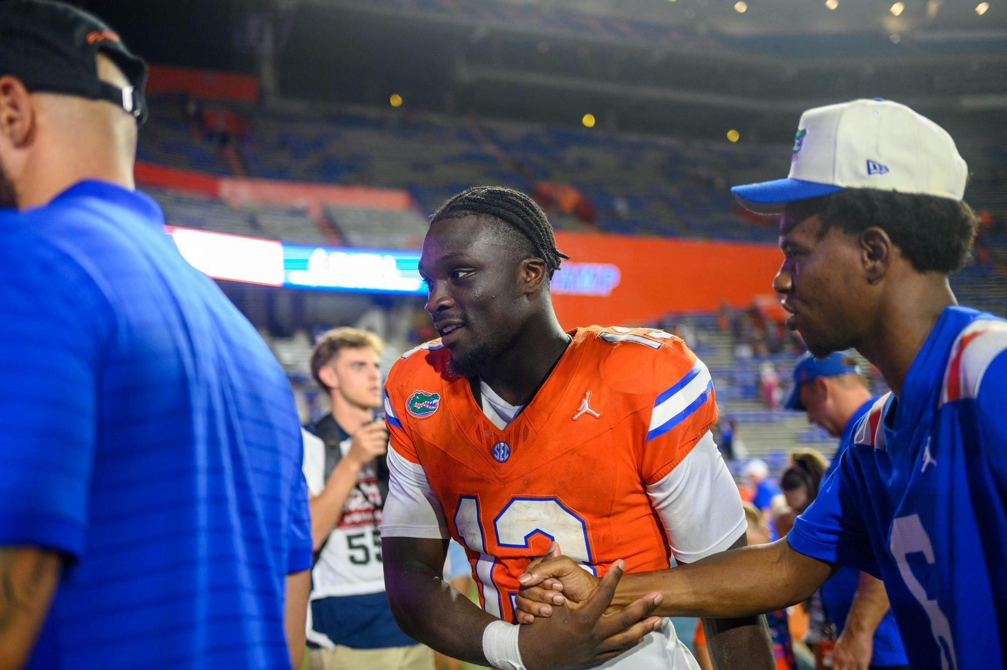 Florida running back Jadan Baugh (13) shakes hands with a fan after an NCAA college football game against Campbell, Saturday, Sept. 12, 2026, in Gainesville, Fla.