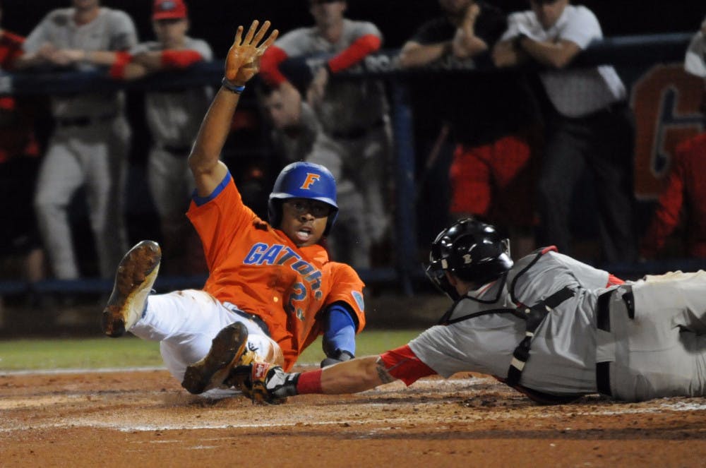 Buddy Reed steals home during Florida's 6-0 win against Georgia on April 22, 2016, at McKethan Stadium.