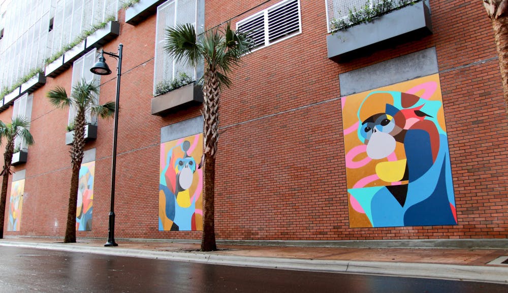 Four colorful murals of monkeys were added to a wall of The Standard Gainesville’s parking garage on Northwest Third Avenue as part of a negotiation with the City of Gainesville. The building encroaches on the Florida Department of Transportation’s property by less than ten feet. 
