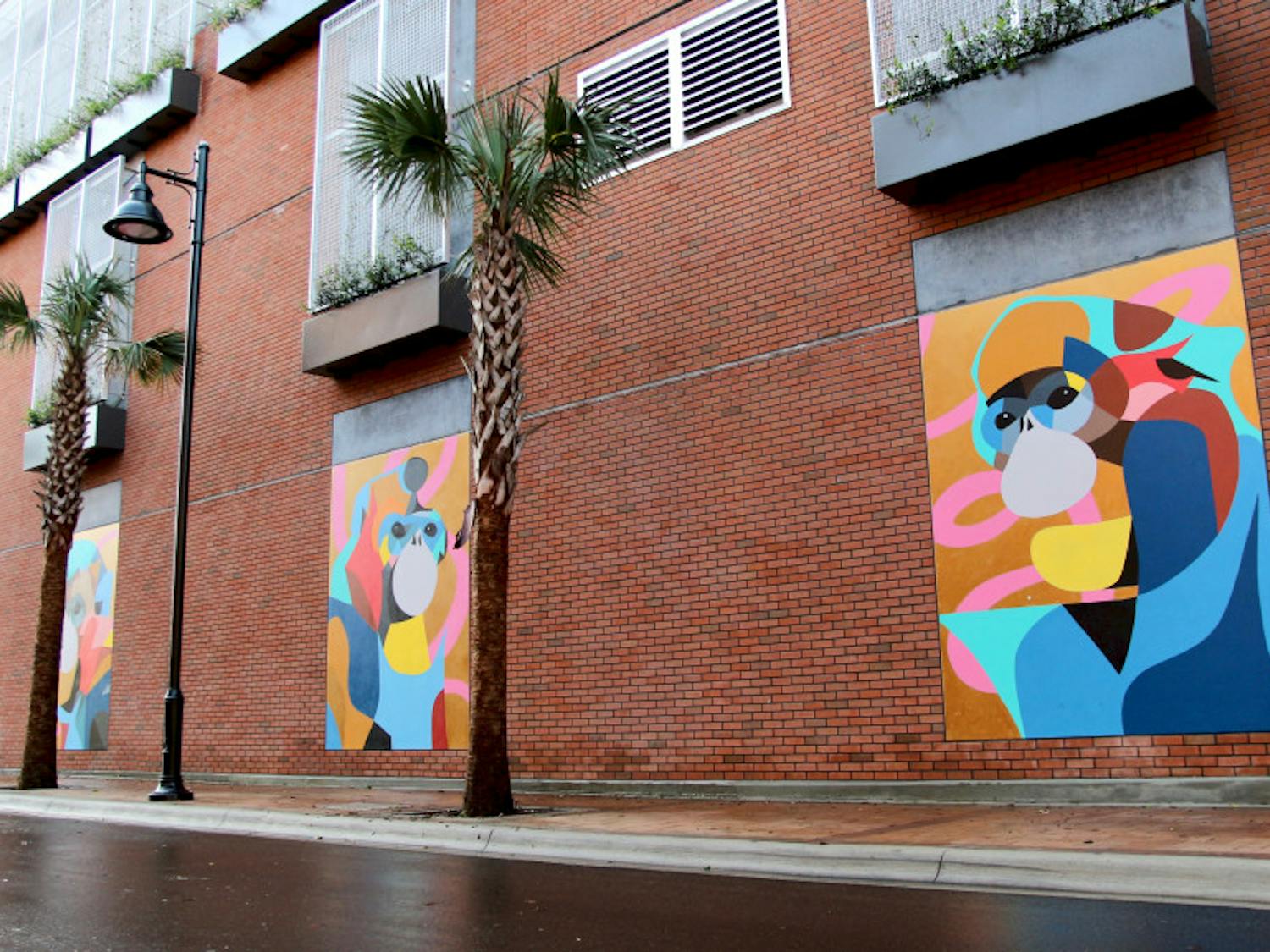 Four colorful murals of monkeys were added to a wall of The Standard Gainesville’s parking garage on Northwest Third Avenue as part of a negotiation with the City of Gainesville. The building encroaches on the Florida Department of Transportation’s property by less than ten feet.
