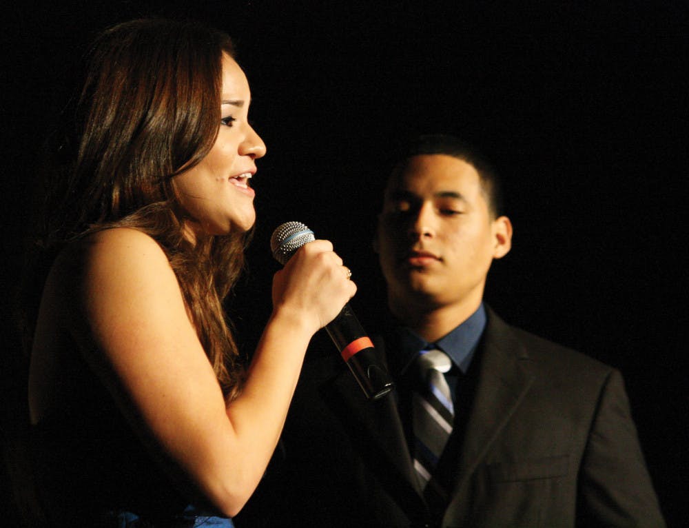 <p>Mistress and master of ceremonies Jennise Acosta and Alex Castro
introduce the acts for the Hispanic Heritage Month Talent Show in
the Reitz Union Grand Ballroom Wednesday night.</p>