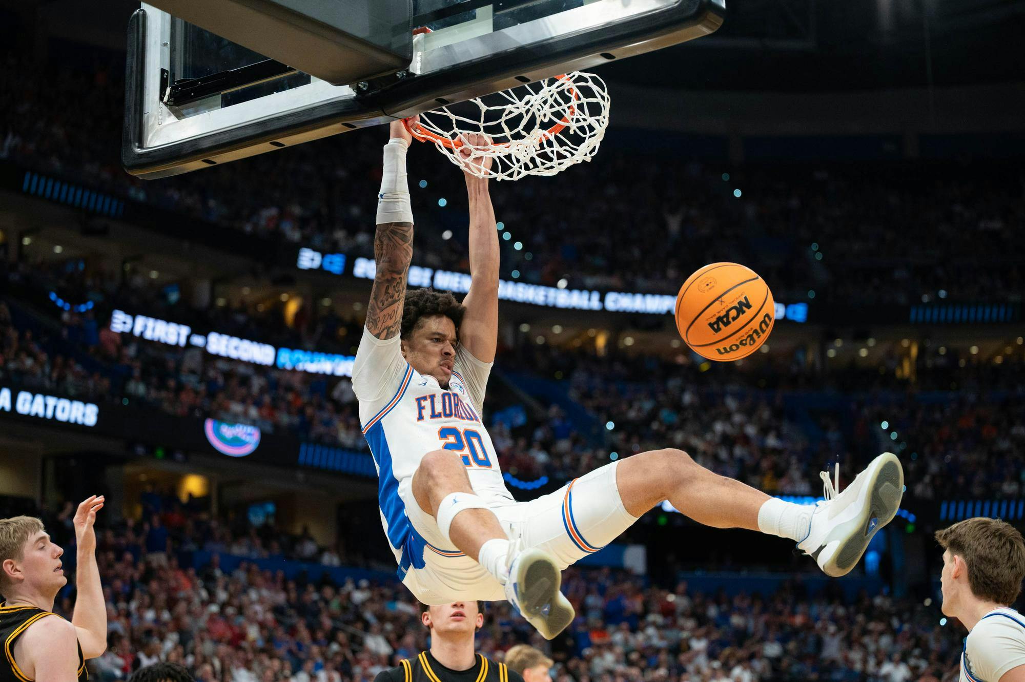Florida guard Isaiah Brown (20) dunks the ball during the second half of an NCAA Tournament second round game against Iowa, Sunday, March 22, 2026, in Tampa, Fla.
