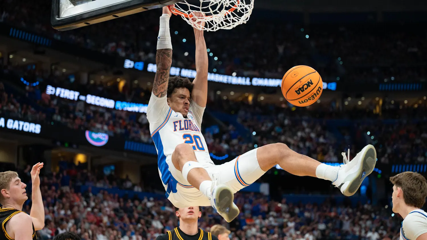 Florida guard Isaiah Brown (20) dunks the ball during the second half of an NCAA Tournament second round game against Iowa, Sunday, March 22, 2026, in Tampa, Fla.