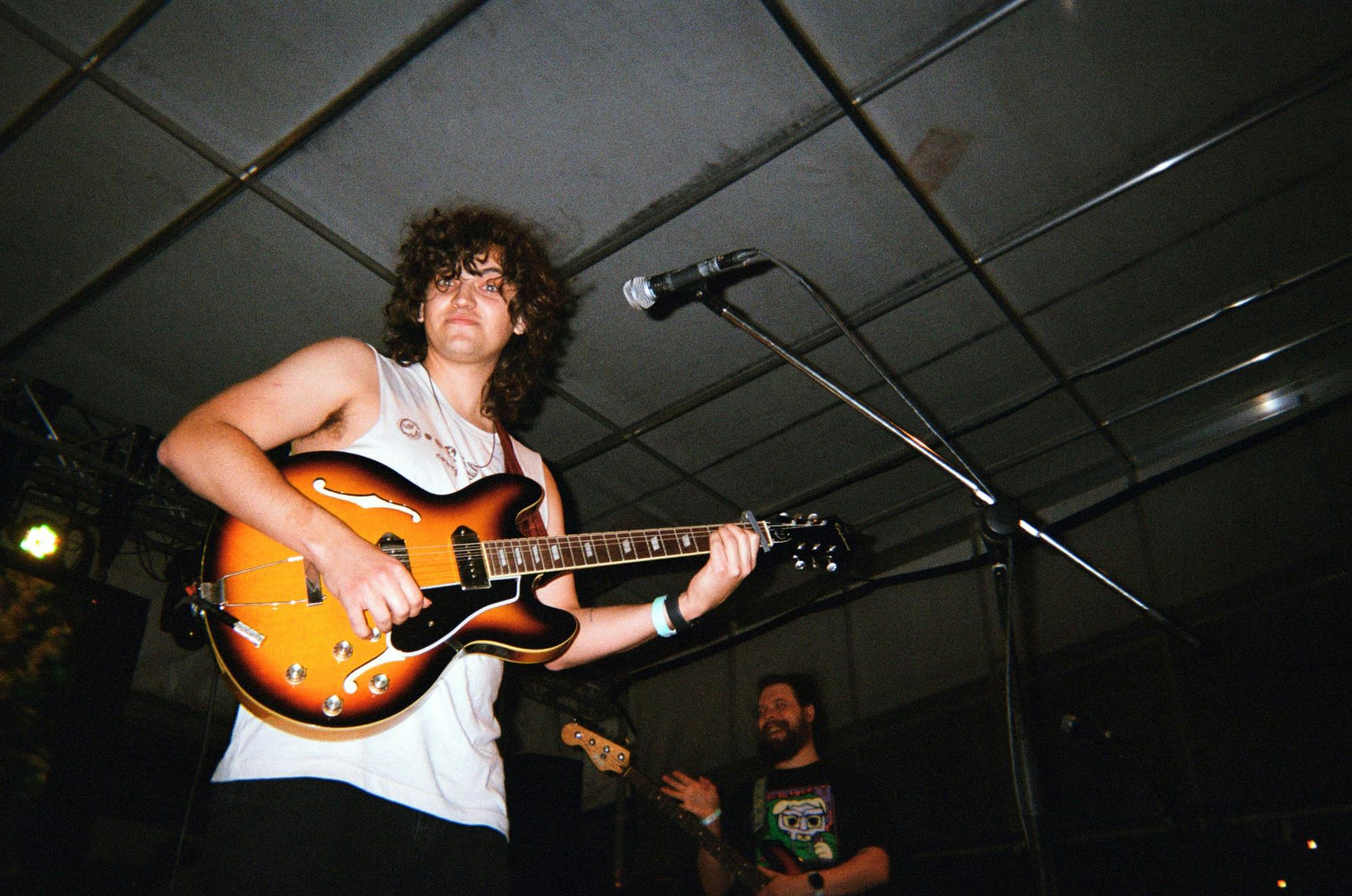 Thomas Allain performs on stage.