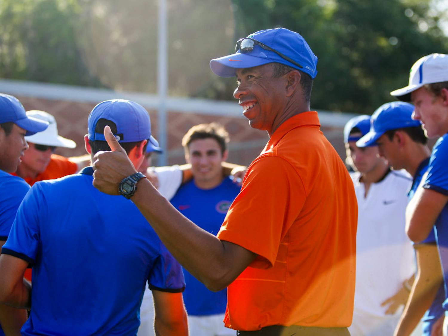 UF men's tennis coach Bryan Shelton joins his team after its Senior Day match with Alabama on April 13.  The Gators went 19-10 on the season and qualified for the NCAA Tournament.