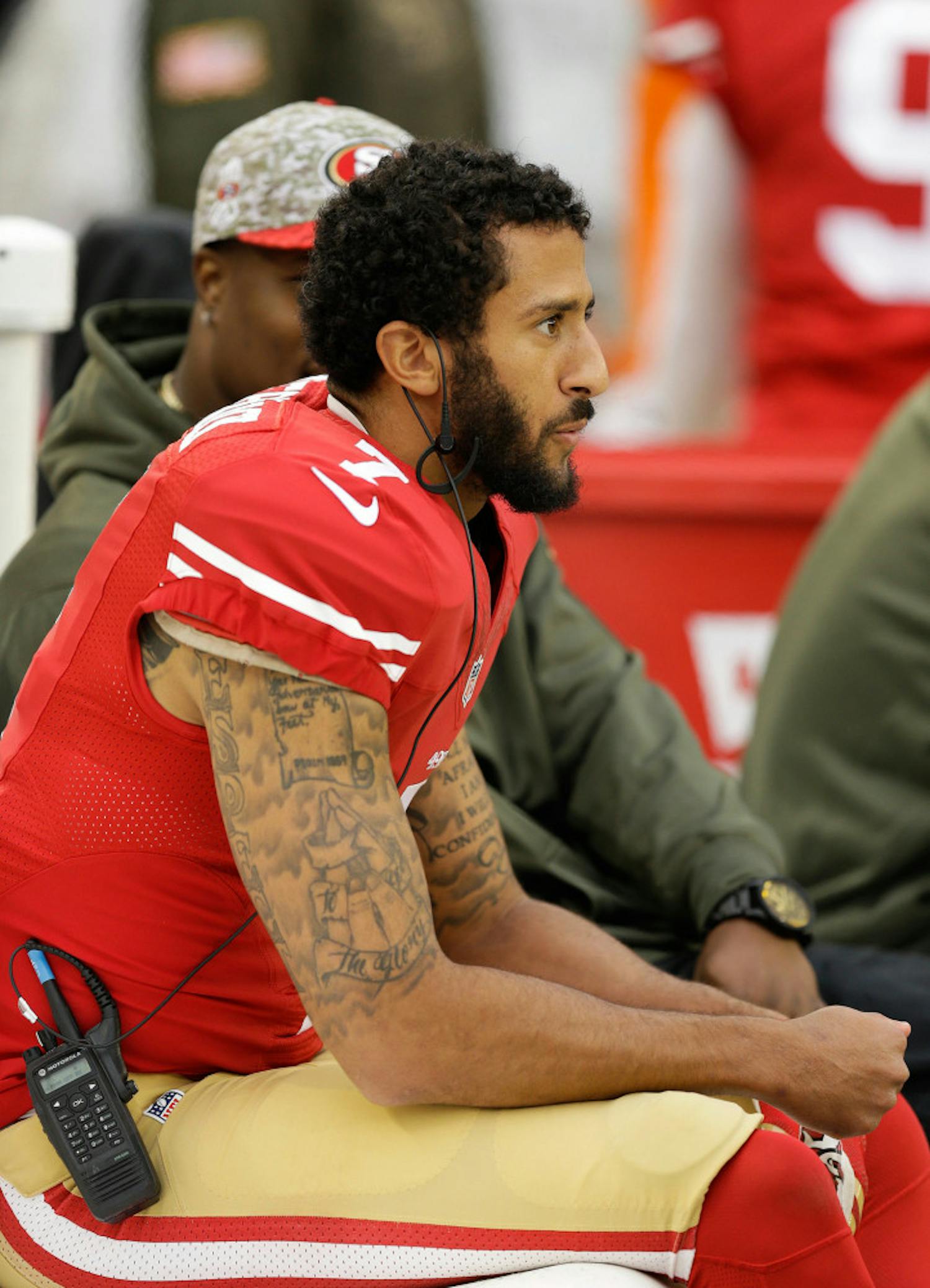 FILE--In this Nov. 8, 2015, file photo, San Francisco 49ers quarterback Colin Kaepernick sits on the sideline during the second half of an NFL football game against the Atlanta Falcons in Santa Clara, Calif. A northern Nevada airport is getting an earful about a decorative display that, in part, highlights Kaepernick, a treasured product of the University of Nevada's football program who in recent days has been in the spotlight over his decision to sit down during the national anthem. (AP Photo/Ben Margot, File)